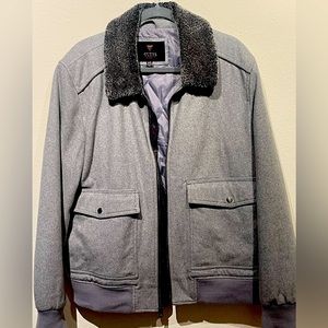 Wool men’s jacket by Guess. Faux fur collar.